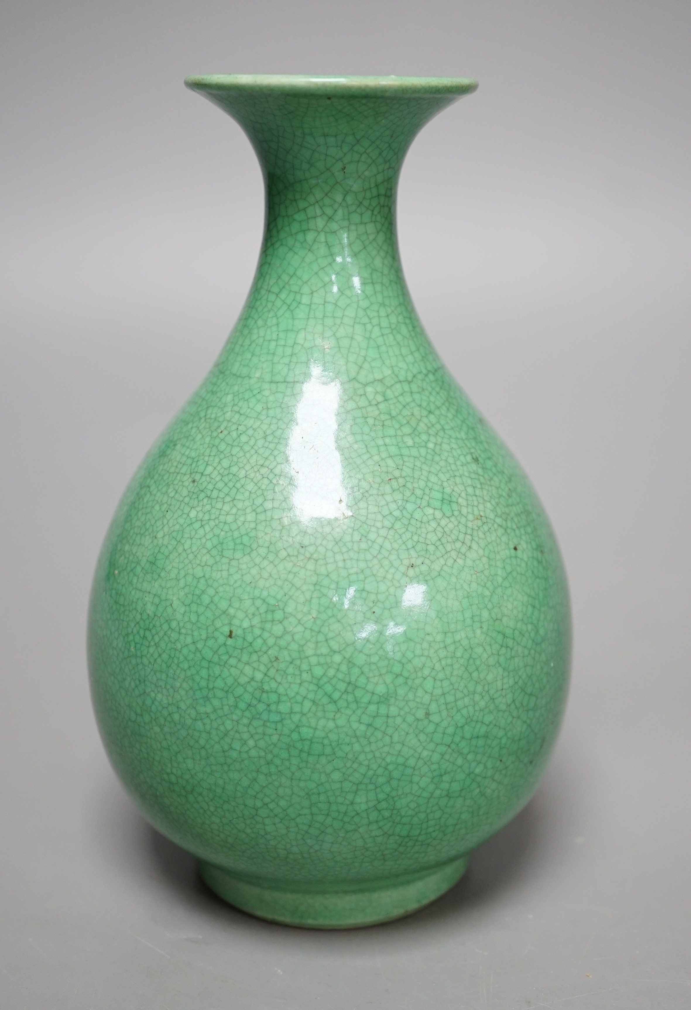 An early 20th century Chinese green crackle glazed vase (a.f.). 17cm.